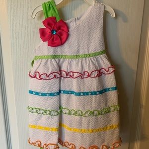 Girls white dress with shoulder detail flower